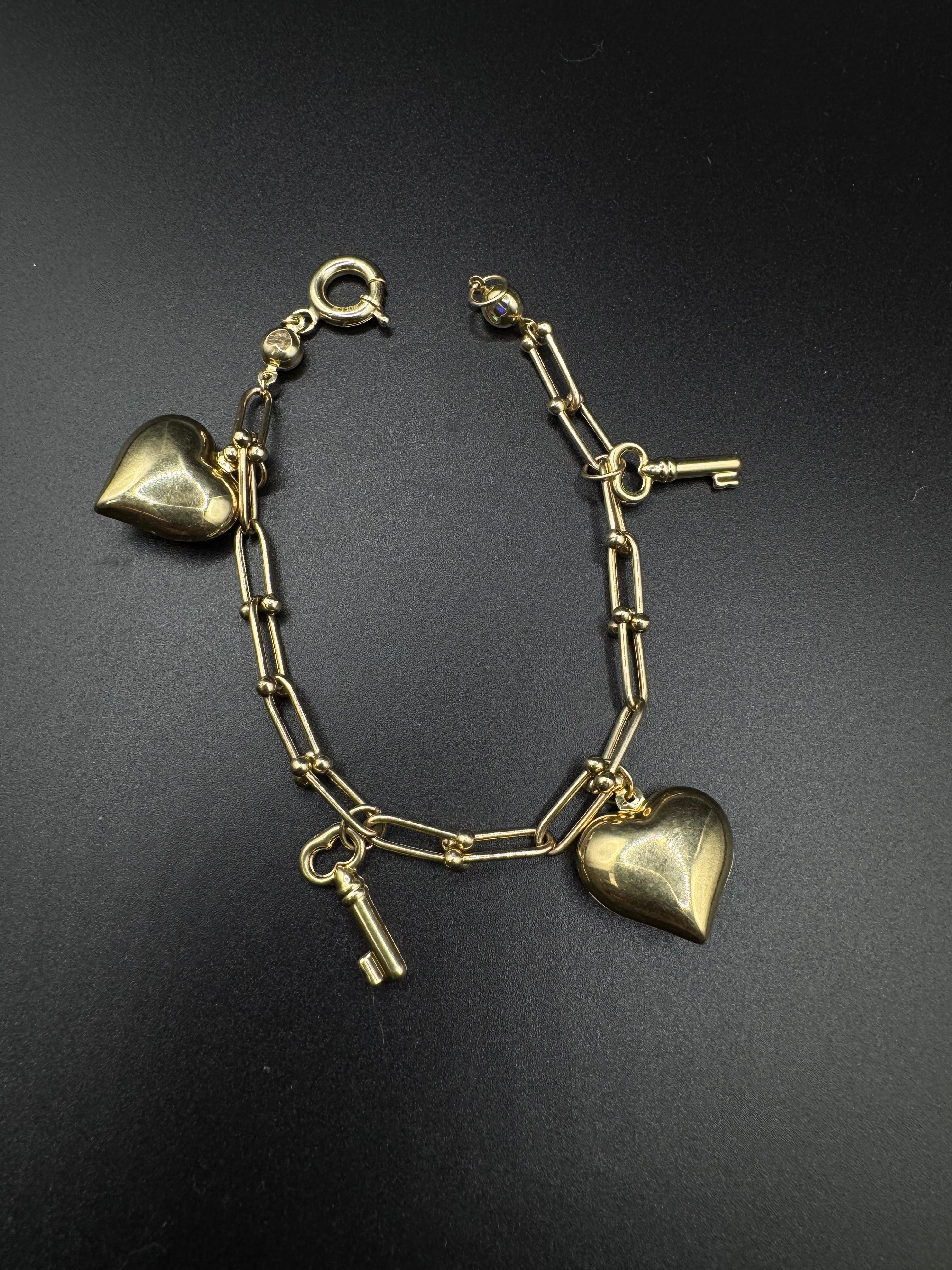 Pulseras con colgantes en 10k